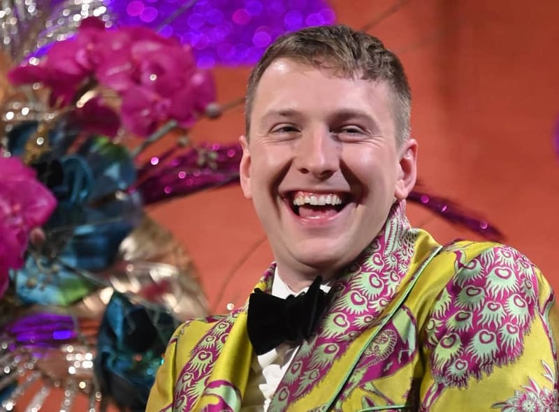 Joe Lycett is one of the UK’s most popular comedians at the moment. Known for his sardonically camp style, whimsical public stunts and elaborate set designs, Lycett has been described as one of Britain’s most popular comedian. 