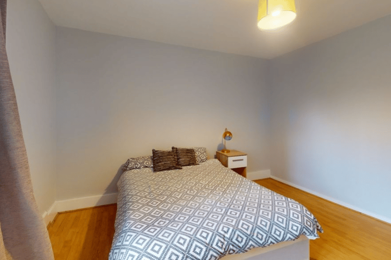 This bedroom has plenty of space that could be used, such as a wardrobe, TV or more