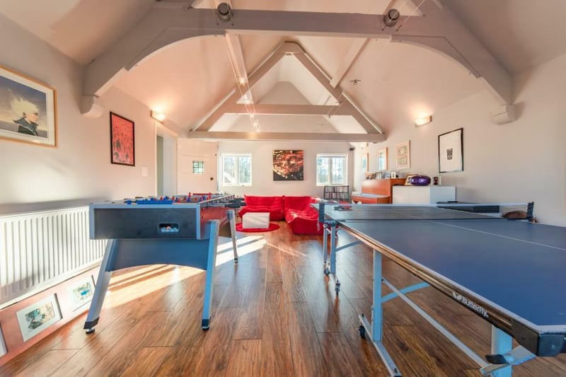 The games room with exposed beams in ceiling.
