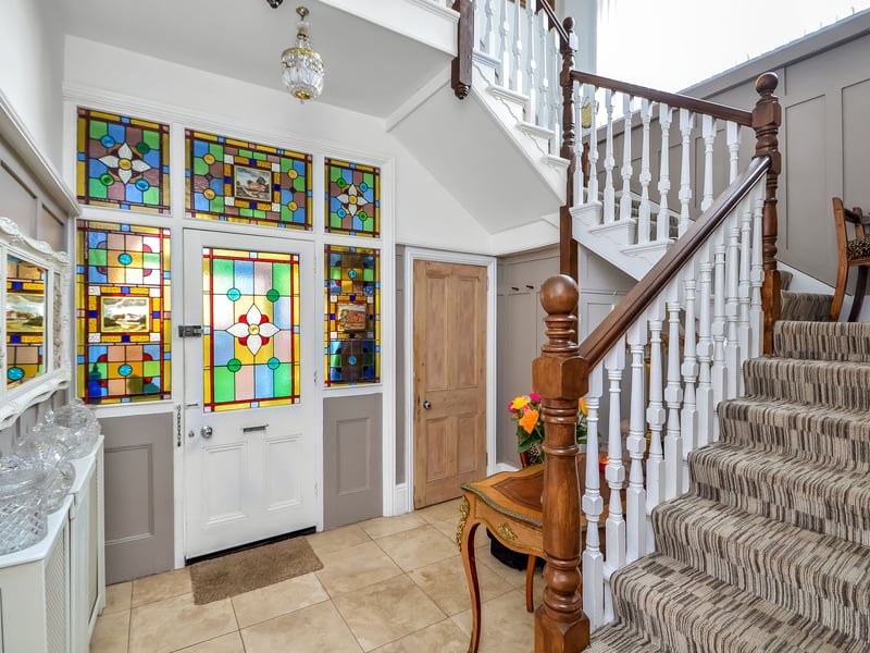 View of the front door and hallway