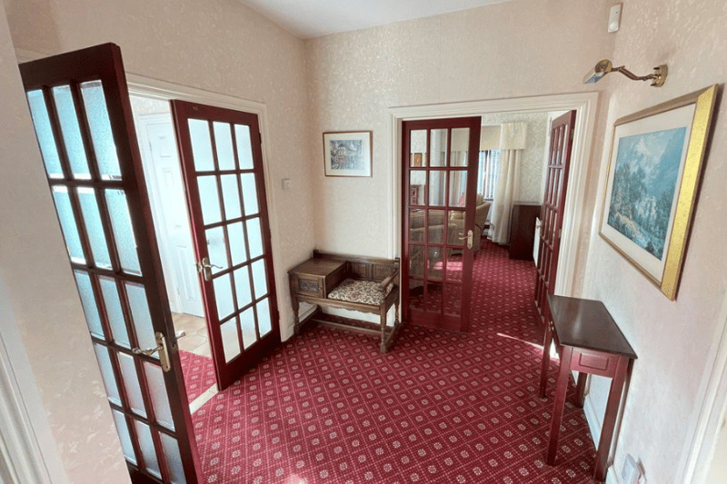 A hallway leading into the main sitting room