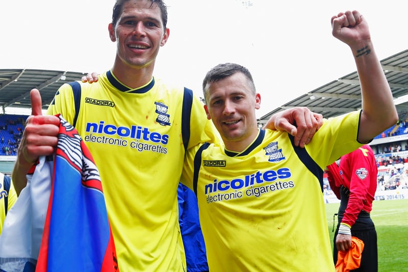 Goal scorers Nikola Zigic and Paul Caddis of Birmingham City celebrate as they avoid relegation 