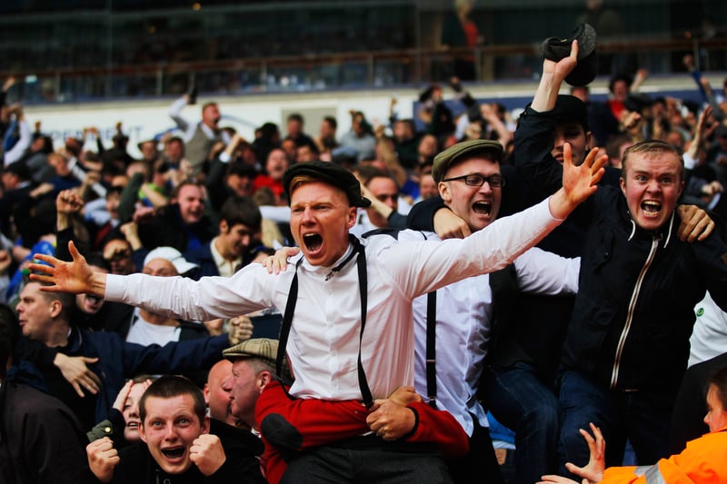 Some Blues dressed in classic Peaky Blinders inspired clothing fans celebrate after full time