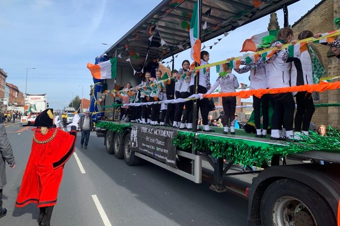 The Lord Mayor of Manchester waves to young Irish dancers on a parade wagon. Photo: Coun Pat Karney