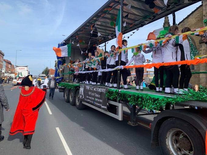 The Lord Mayor of Manchester waves to young Irish dancers on a parade wagon. Photo: Coun Pat Karney