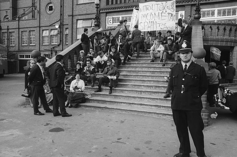 13th July 1966:  Guarded by one policeman Spanish fans queue at the gates of Villa Park, Birmingham to see the World Cup match between Spain and Argentina. Argentina won 2-1.  (Photo by Central Press/Getty Images)