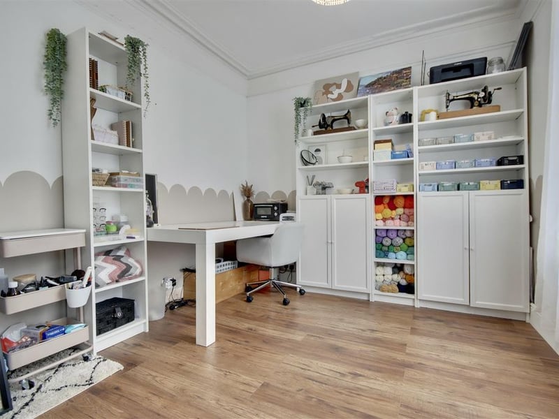 The separate sitting room that is currently being used as a creative office space