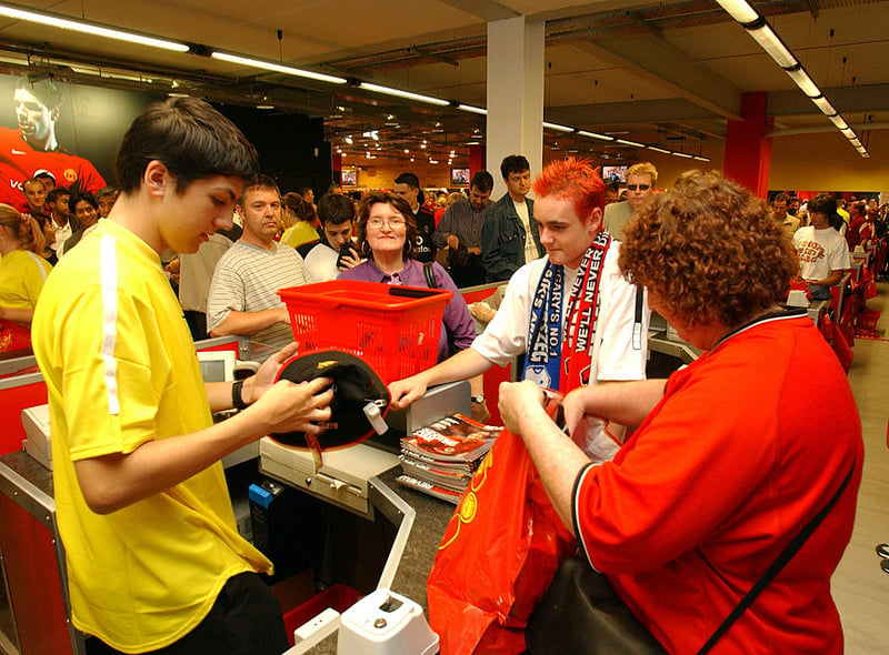 United fans queue at the Old Trafford Megastore in 2022, the year Nike began manufacturing the team’s kit. (Photo by John Peters/Manchester United via Getty Images)