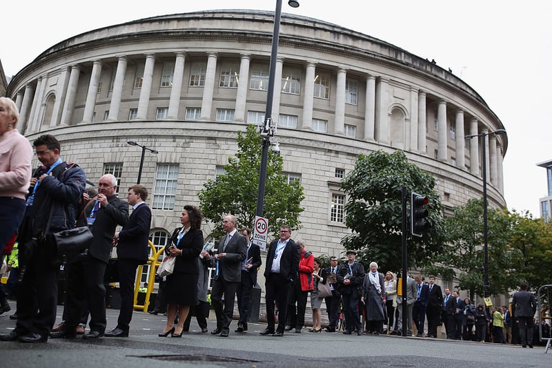 Delegates queue for the Conservative Party Conference in 2015. (Photo by Dan Kitwood/Getty Images)