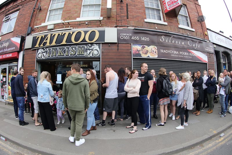 People queue outside Inkism Tattoo Studio in Altrincham, which was one of the local studios that raised money for the victims of the 2017 arena attack by tattooing Manchester bees on customers.  (Photo by Christopher Furlong/Getty Images)