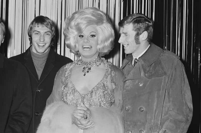 Entertainer Danny La Rue (1927 - 2009) with Manchester City FC players Tonny Book and Derek Jeffries Credit: Getty