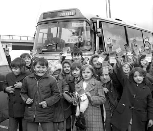 Excited youngsters with their tickets on their way to Manchester airport for a round Britain flight on a BAC Super 1-11 jet.