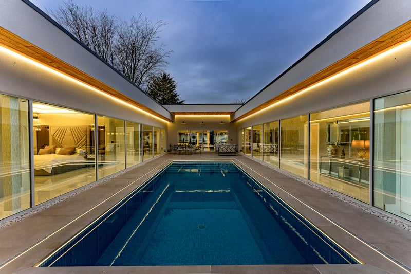 The two wings of the house surround a gorgeous pool.
