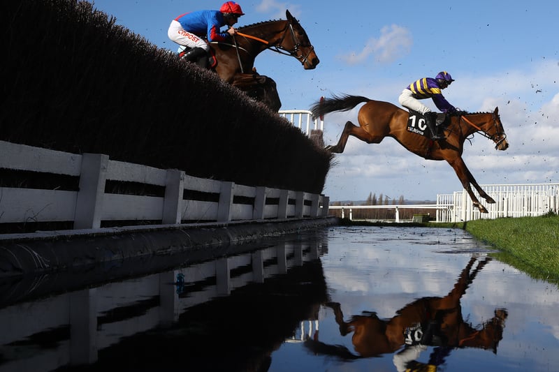  Derek Fox (r) riding Corach Rambler takes the water jump on his way to winning  the Ultima Handicap Chase