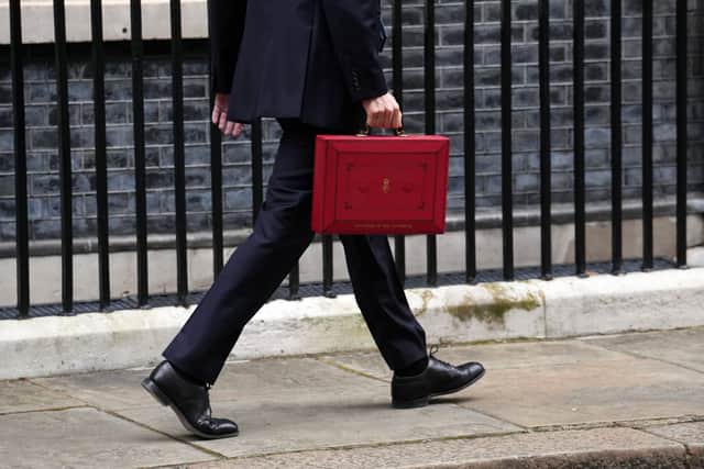UK Chancellor Jeremy Hunt leaves Downing Street with the despatch box after presenting his spring budget to parliament on March 15, 2023 in London, England. Highlights of the 2023 budget are an increase in the tax-free allowance for pensions which the Chancellor hopes will stem the number of people taking retirement, a package of help for swimming pools affected by the increase in energy bills and changes to childcare support for parents on universal credit. (Photo by Carl Court/Getty Images)