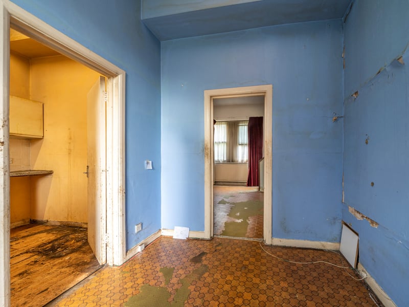 The hallway shows the house is in need of some renovation