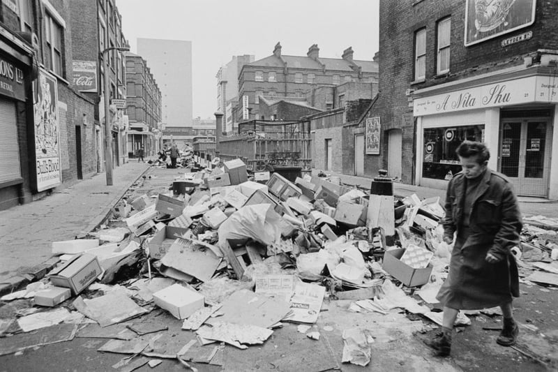 A man walking past a pile of rubbish on Leyden Street, as waste collectors were on strike to ask for a pay rise, London, UK, February 5, 1979. (Photo by Maurice Hibberd/Evening Standard/Hulton Archive/Getty Images)