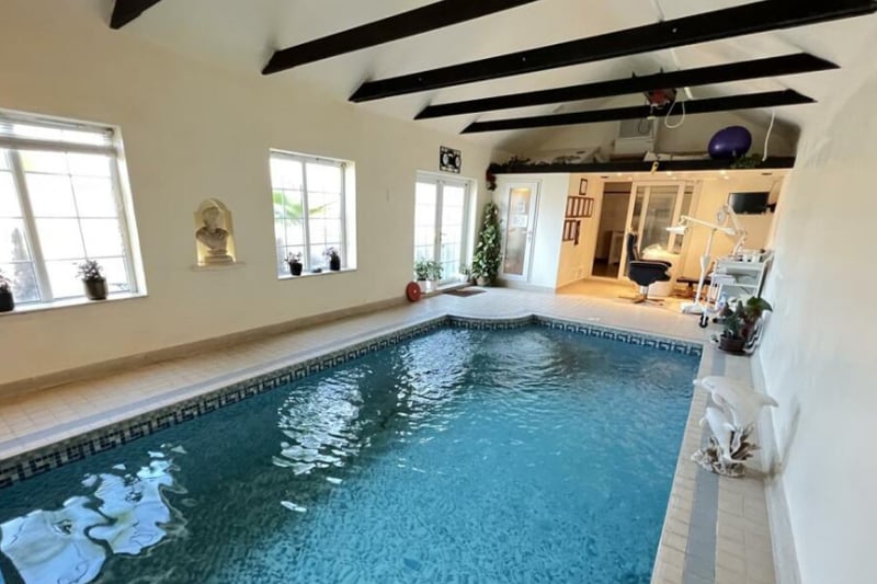 The home has a heated indoor pool, designed for leisure and therapeutic use. 