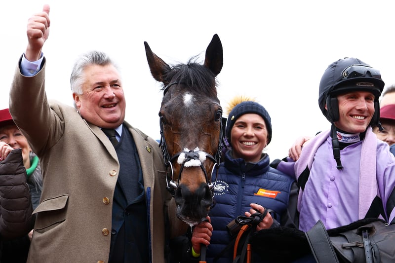 Trainer Paul Nicholls (L) celebrates alongside Harry Cobden on board Stage Star after winning the Turners Novices Chase during day three of the Cheltenham Festival