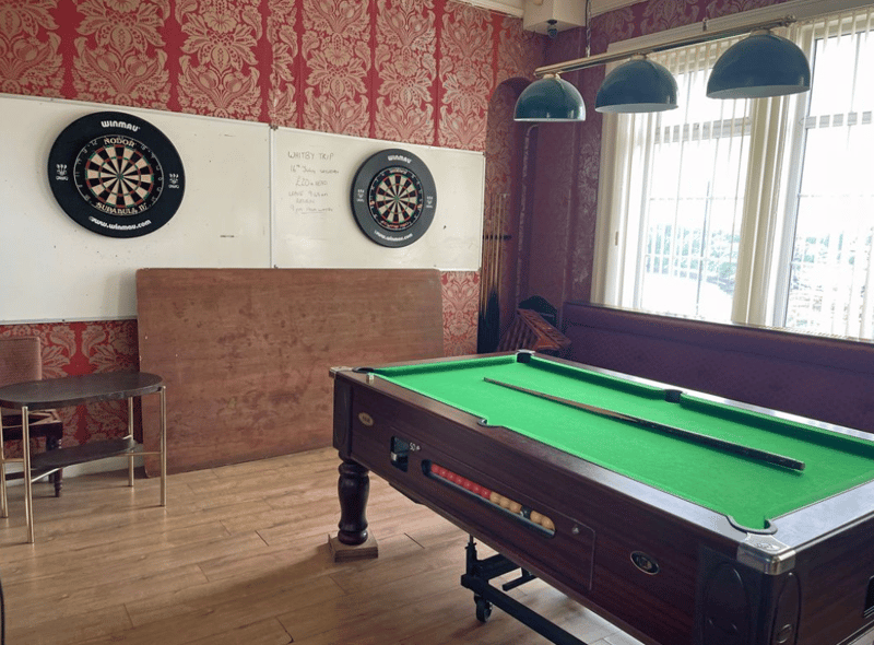 Two dart boards and a pool table, staples of any pub!