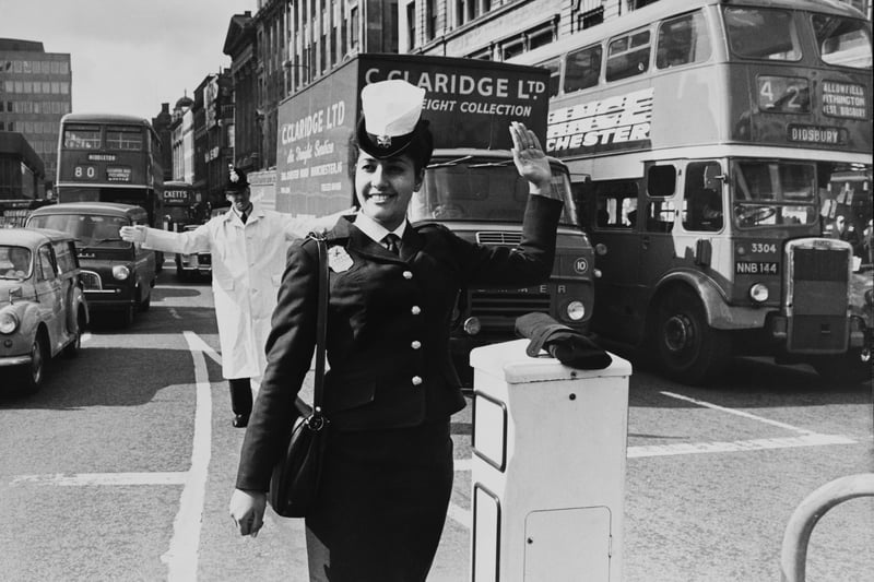 Teenaged Edna Avivi, a police officer from Tel Aviv in Israel, carries out point duty on a busy junction in the Piccadilly area of Manchester Credit: Getty