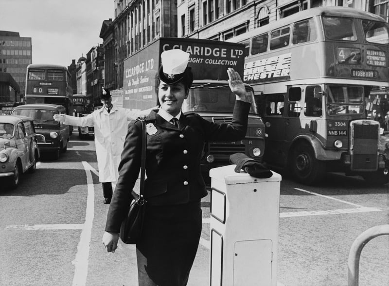 Teenaged Edna Avivi, a police officer from Tel Aviv in Israel, carries out point duty on a busy junction in the Piccadilly area of Manchester Credit: Getty