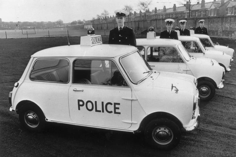 Officers standing by four of the ten Mini Coopers which are a new addition to the Manchester city police force. Credit: Getty