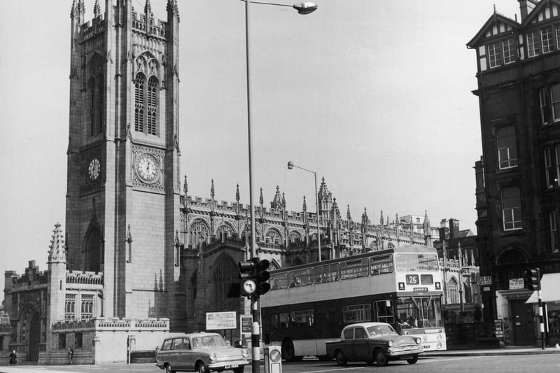 Manchester Cathedral. A number 26 bus passes on its way to the Cannon Street bus station. Credit: Getty