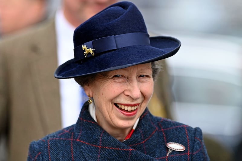 The royal raises a smile as she attends the final day of the festival