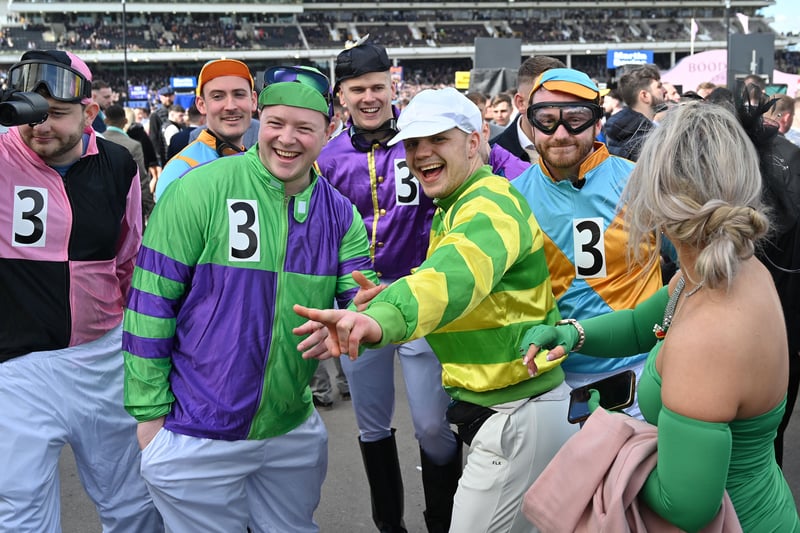A group of race-goers have a joke as they enjoy the final day of this year’s Cheltenham Races