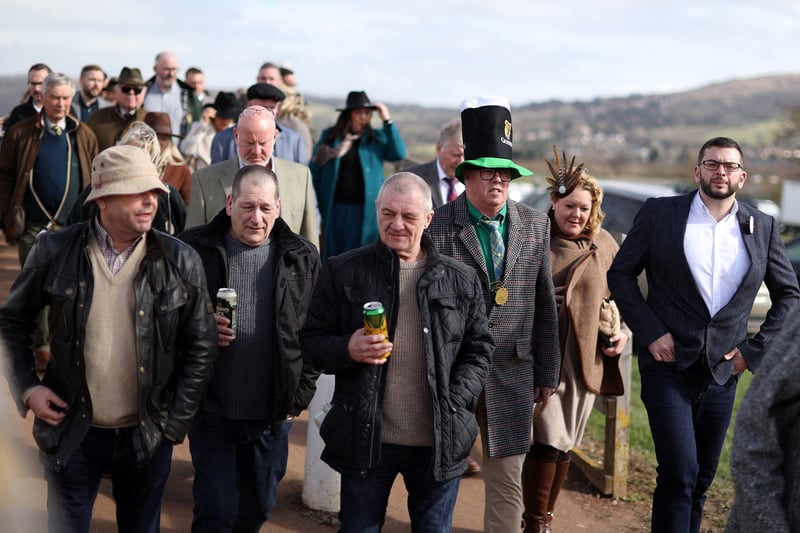 Scrumpy Jack and Holston Pills cans in hand as race-goers arrive fo the festival. One man can be seen wearing a Guinness St Patrick’s  Day hat