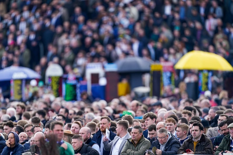 Thousands have attended this year’s festival - this image shows many looking nervously on during a race