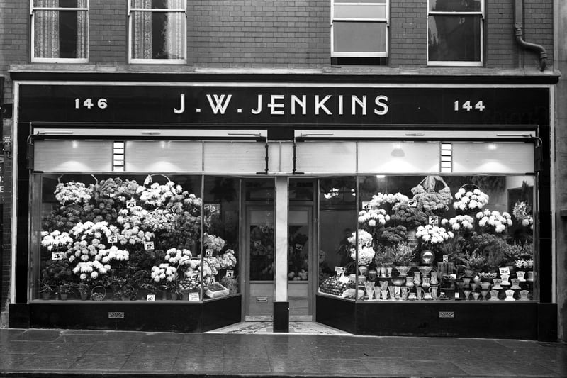 You wouldn’t miss this shop front with all the flowers on display. JW Jenkins was a florist shop, pictured here in 1959. The store is now a Wilko shop.