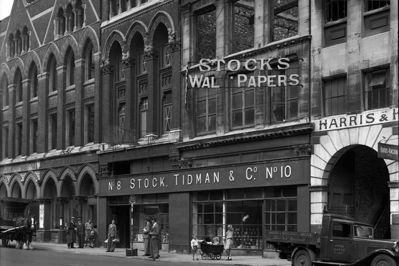 Firm evidence here of the impact of bombing during the Second World War. This picture from 1951 shows the wallpaper manufacturers with the bombed-out Victoria Street Post Office on the left.