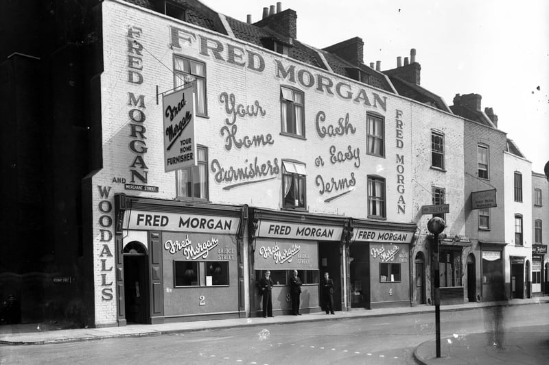 You won’t miss Fred Morgan! Staff stand outside the shop covered with lettering advertising the business. The shop would make way for development in Broadmead with the Galleries to be built opposite it.