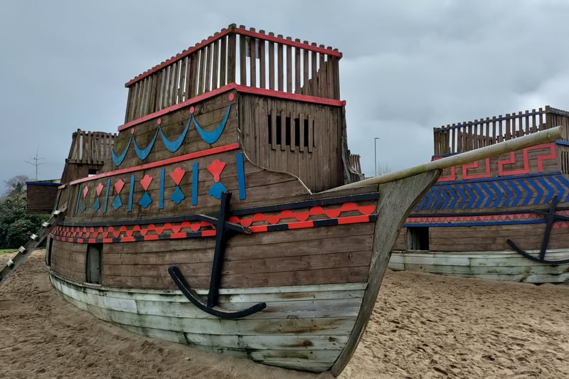 Children can climb over and inside these two big ships which are surrounded by sand