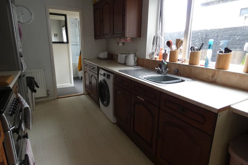 Kitchen with space for a washing machine and fridge/freezer