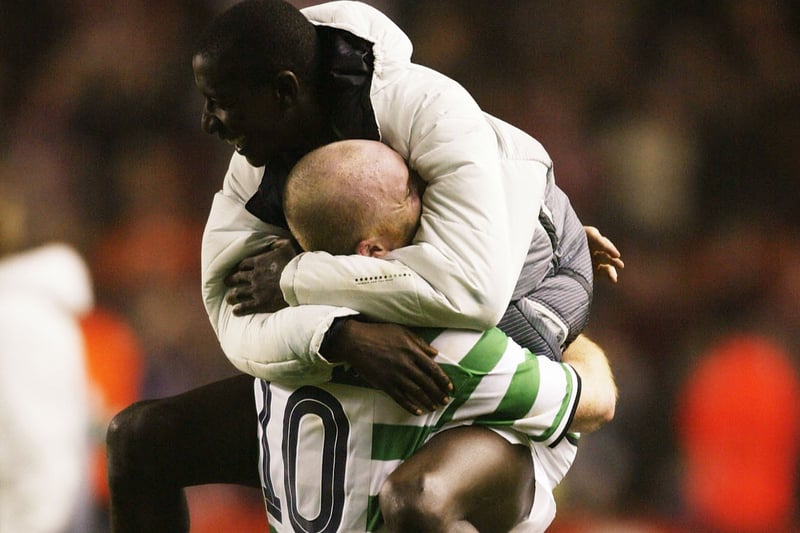 Celtic team mates John Hartson and  Mohammed Sylla celebrate their famous win at Anfield at the expense of their English rivals on a night to savour