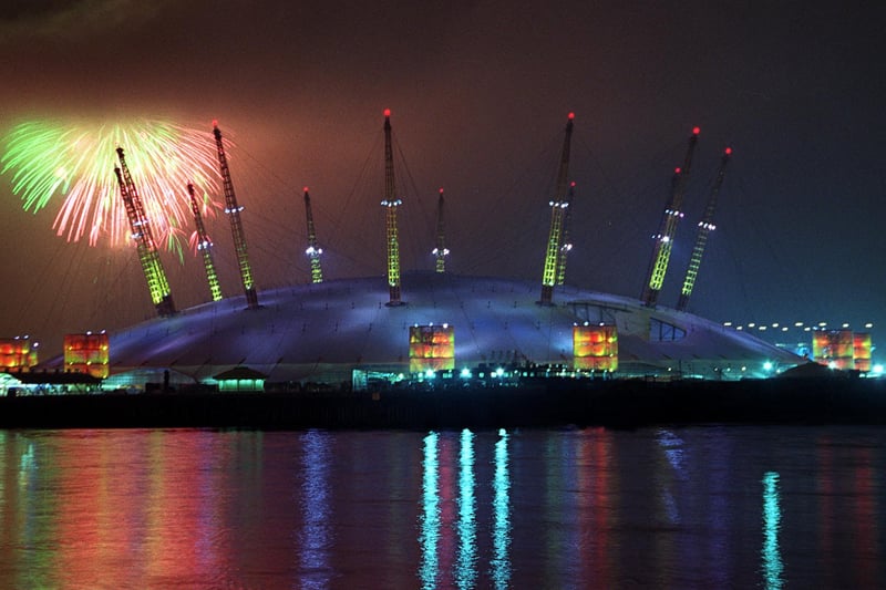 Fireworks lit up the sky as January 1 2000 arrived, although low cloud threatens to engulf Britain’s flagship dome. (Photo by Hugo Philpott/AFP via Getty Images)