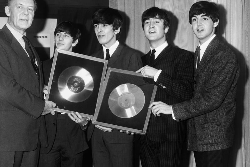Sir Joseph Lockwood, chairman of EMI, presents the Beatles with two silver discs, to mark the 1/4 million plus sales of their two long playing records, ‘Please, Please Me’ and ‘With The Beatles’, November 1963.