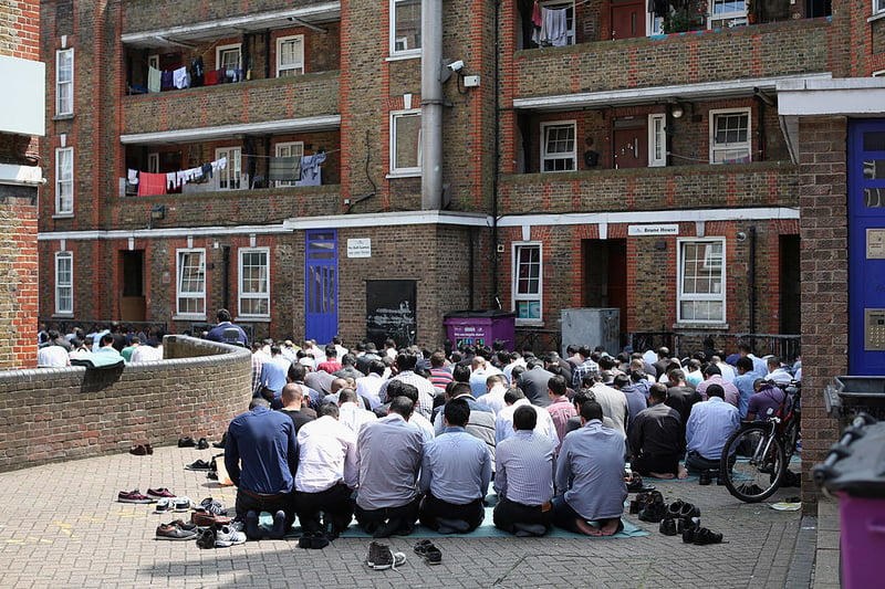 Muslims perform the Friday prayer during Ramadan outside the BBC Community Centre on the Brune Estate on July 12, 2013 in London, England.   (Photo by Oli Scarff/Getty Images)