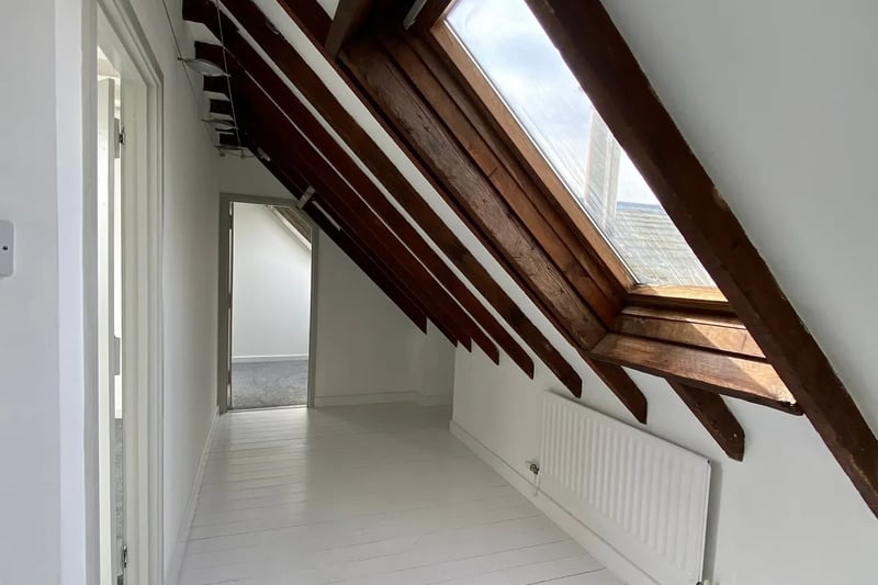 The landing benefits from pitched attic windows 
