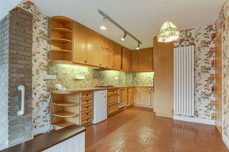 A broader look of the kitchen, with great storage space