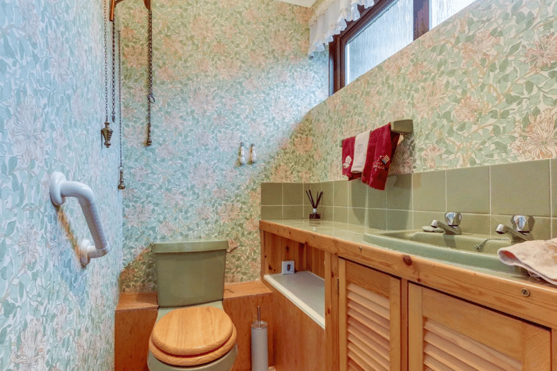 A small toilet and basin area seen here