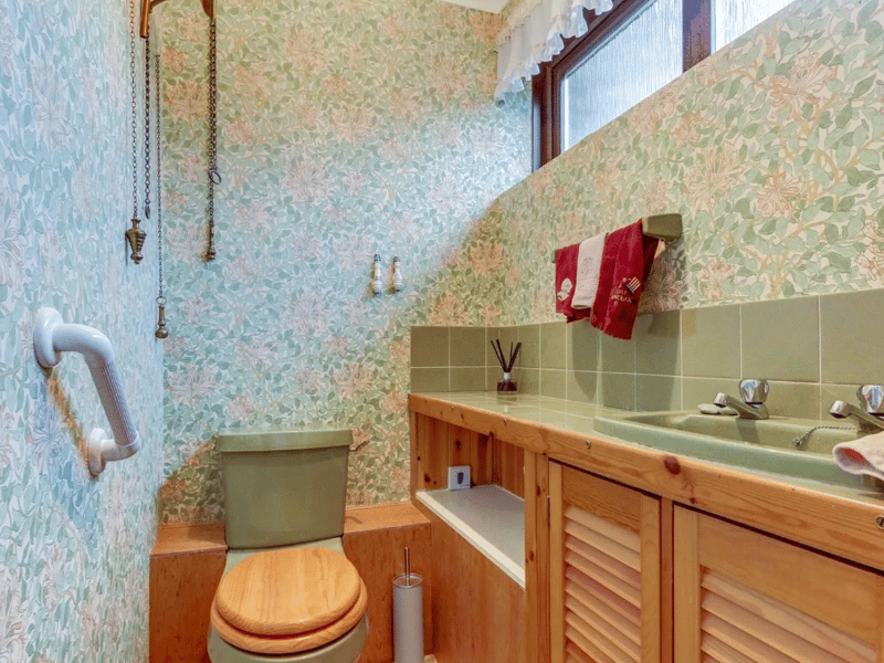 A small toilet and basin area seen here