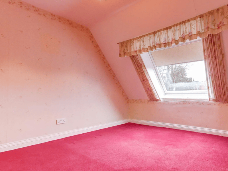 With the slanted window, this makes for a perfect bedroom