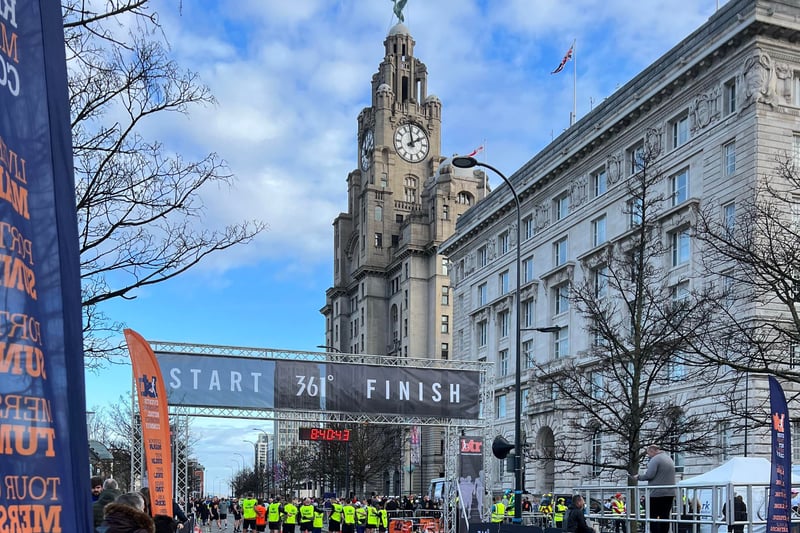 Pacers stand at the start line.