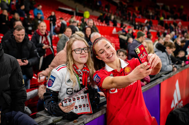 United defender Maya Le Tissier poses for a selfie with a fan.