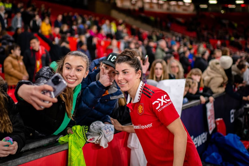 A fan makes sure she grabs a photo with goalscorer Lucia Garcia, who bagged two goals in the 4-0 win over West Ham.