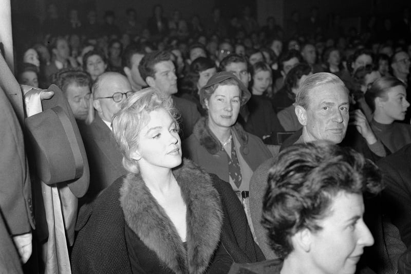 American actress Marilyn Monroe attending a debate on the Theatre, at the Royal Court Theatre in London where  her husband Arthur Miller is speaking. 18th November 1956. (Photo Mirrorpix/Omnibus)
